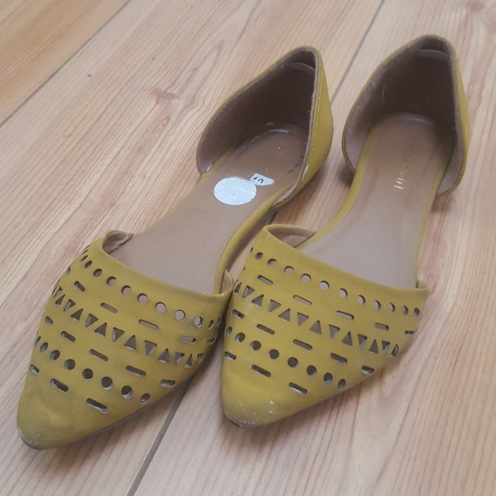 Yellow flats with cut out design